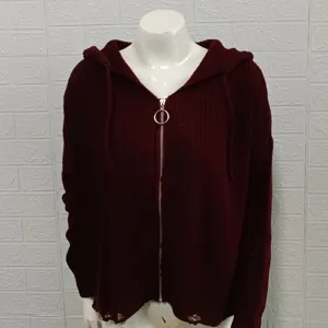 Burgundy knit hooded cardigan detail, featuring metal ring zipper and distressed hem design.
