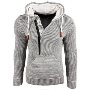 Men's grey knit hooded sweatshirt detail, featuring quarter zip and cozy textured fabric.