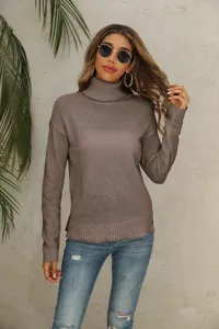 Women's solid color turtleneck long sleeve knitted sweater basic commuter top apparel detail.