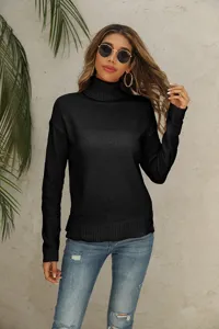 Detail view of a black turtleneck knit sweater worn by a model against a neutral background.