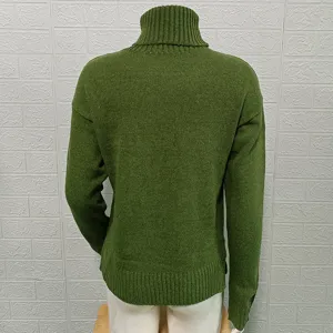 Back detail of solid green turtleneck long sleeve knitted sweater, ribbed hem and collar.