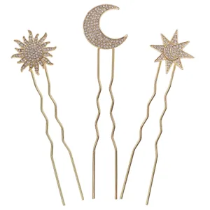 Gold rhinestone celestial hair pin set featuring sun, moon and star motifs for bridal updo.