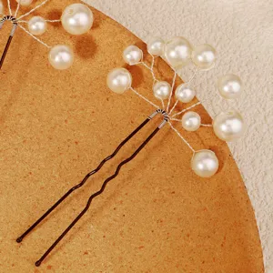 Handmade bridal pearl U-shaped hair pin, minimalist beaded wedding hair styling accessory.