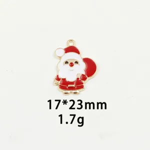 Close-up detail of the cute Santa Claus enamel pendant, glossy red and white finish.