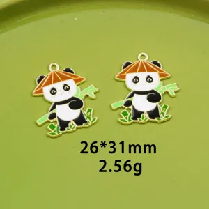 Close-up detail view of cute panda metal enamel charms, alloy DIY jewelry pendant accessories.