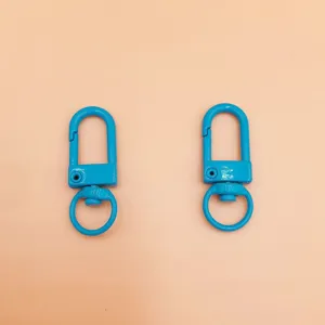 Blue metal swivel snap hook detail, durable zinc alloy keychain clasp for bags and crafts.