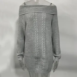 Grey off-shoulder cable knit sweater detail showing textured fabric and collar design.