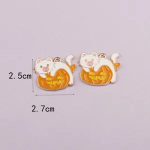 Close-up detail of Halloween cat on pumpkin enamel alloy DIY jewelry charm accessory.