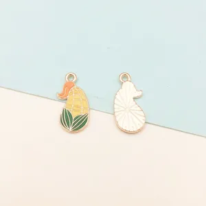 Close-up detail of cute corn enamel charms with vibrant colors, ideal for DIY jewelry crafting.