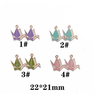 Detailed view of DIY enamel origami crane alloy charms, cute pendant accessories for bracelets.
