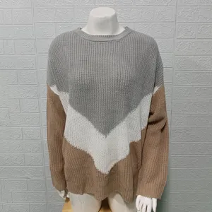 Detailed view of the colorblock knit sweater featuring a chevron pattern, long drop shoulders.