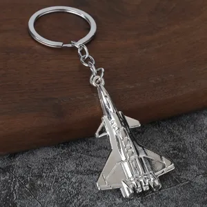 Detailed view of a creative silver metal fighter jet keychain pendant, perfect for keys and bags.