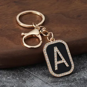 Rhinestone letter A metal keychain pendant, stylish black enamel bag accessory and car key ring.