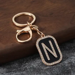 Gold metal rhinestone letter N keychain pendant accessory for car keys and bags detail view
