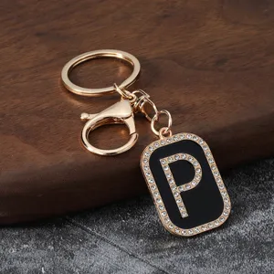 Rhinestone letter P keychain metal pendant accessory for car keys bag decor.