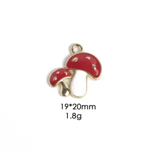 Detailed close-up of the red mushroom alloy charm, showing vibrant enamel and smooth metallic edge.