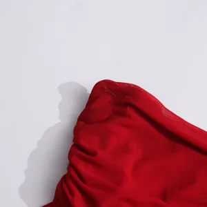 Close up detail of red sheer mesh ruched fabric texture for elegant summer fashion style