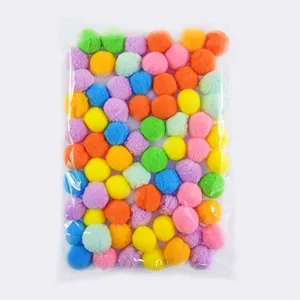Colorful pom pom balls for cat toys and DIY crafts, packed in a transparent bag detail view.