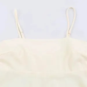 Close-up detail shot of women camisole dress featuring square neckline and adjustable thin straps.