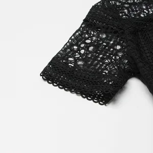 Détail de manche de robe en dentelle noire, broderie crochet complexe pour femmes.