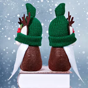 Christmas gnome plush toy with knitted green hat and reindeer horns for holiday decor.