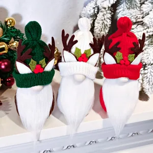 Christmas gnome plush toy detail view, knitted curved hat with antlers and white beard decor.