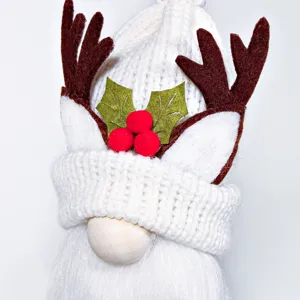 Christmas gnome plush doll with knitted hat and cute reindeer antlers for home decor.