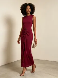 Sleeveless maxi dress in maroon with elegant twist detail, perfect for summer evening wear.