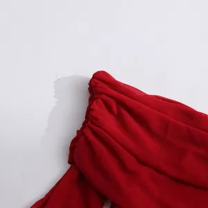 Close up view of red mesh ruched detail for stylish women fashion dress fabric texture design