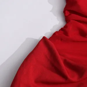 Red mesh ruched fabric detail close up shot showing soft sheer texture and pleat design.