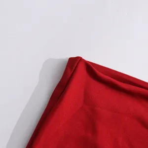 Detailed view of smooth red fabric texture showing high quality material and fine stitching work.