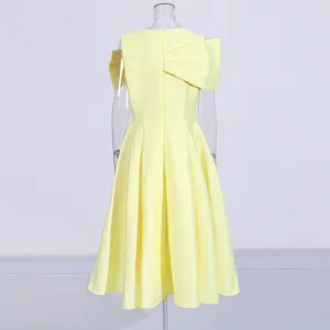 Yellow midi dress back detail, waist cinching design with a big bow and short sleeves.