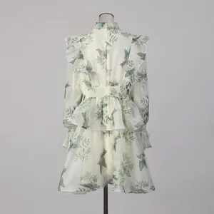 Elegant women's long sleeve mini dress featuring a charming green bird and botanical print design.