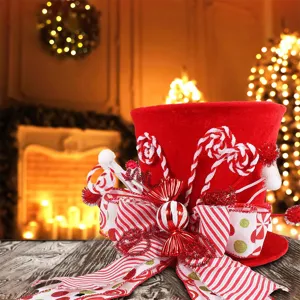 Red velvet Christmas tree topper hat with candy canes and bow, festive holiday home decor.
