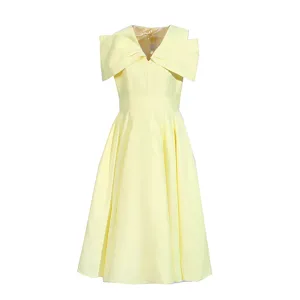 Elegant yellow midi dress featuring a V-neck, short sleeves, and a chic bow shoulder design.