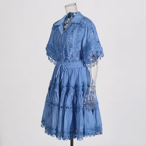 Elegant blue lace embroidered short sleeve shirt and pleated skirt set for summer fashion.