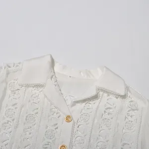 White lace embroidered collar shirt detail view, featuring delicate hollow-out lace and buttons.