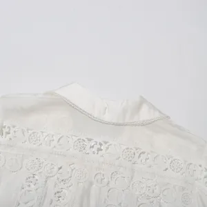 White vintage lace embroidered short shirt detail showcasing exquisite craftsmanship and classic style.