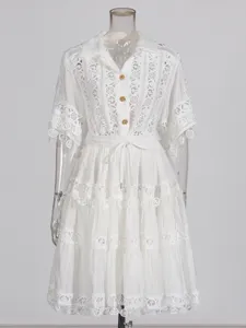 Elegant white lace short sleeve shirt and tiered skirt set, retro chic summer outfit for women.