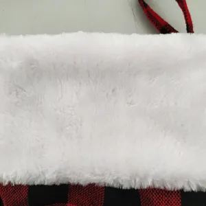 Red and black buffalo check Christmas stocking with white plush cuff for holiday tree decor