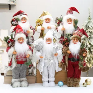 Bambola statuetta Babbo Natale in piedi con zaino e stivali per decorazione natalizia.
