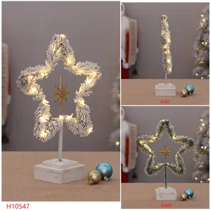 Verschneiter beleuchteter Stern Weihnachtsbaum Weihnachtsdeko mit warmen LEDs Fenster
