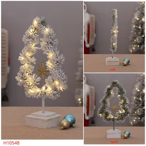 Schneebedeckter LED beleuchteter Weihnachtsbaum Tischdeko mit Stern, Mehrfachansicht.