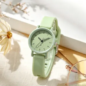 Simple light green silicone strap quartz watch for women, stylish student wristwatch detail.