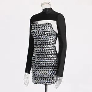 Sexy rhinestone bodycon dress set featuring long sleeve top and sparkly mini dress.