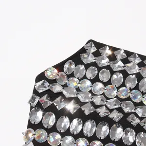 Stunning rhinestone embellished black dress detail, glittering crystal strapless style.