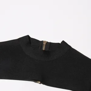 Black knit shrug collar detail showcasing premium zipper design and elegant neckline finish.