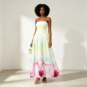 Elegant strapless long dress with gradient yellow hue and stunning pink floral hemline.