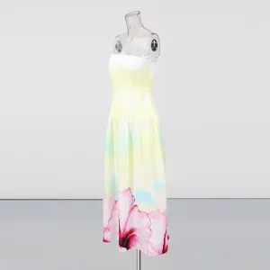 Detail view of the gradient strapless long dress, highlighting the elegant floral print hem.