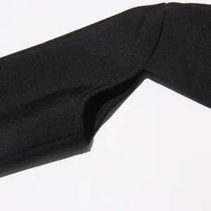 Black ribbed knit bolero sleeve detail close-up showcasing fine fabric texture and design.